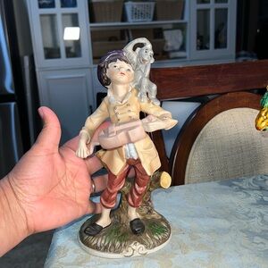 Iolinist and the monkey porcelain figurines